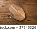 Oval cutting board with knife and fork  37846326