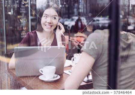 Happy two students listening to music Happy two students listening to music 37846464
