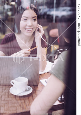 Pleasant two students enjoying music Pleasant two students enjoying music 37846465