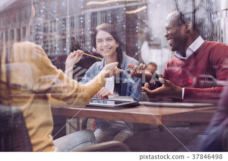 Merry three colleagues joking while working 37846498