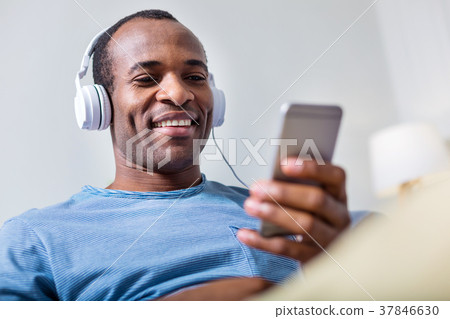 Cheerful happy man enjoying the music 37846630