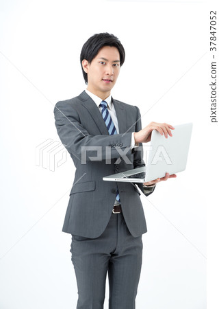 A businessman with a personal computer A businessman with a personal computer 37847052