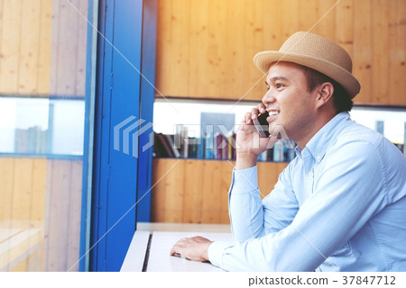 close up of Young Man using telephone  37847712
