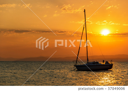 Boat sailing in sea against sky during sunset 37849006