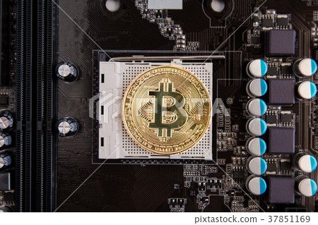 Golden Bitcoin coins on Motherboard, miner 37851169