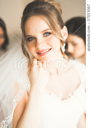 Beautiful bride wearing fashion wedding dress with 37853067
