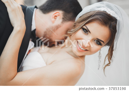Romantic couple dancing and kissing on their Romantic couple dancing and kissing on their 37853198