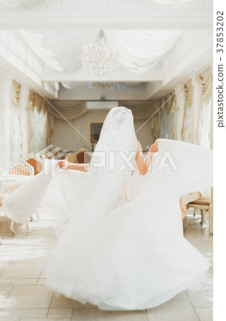 Beautiful bride wearing fashion wedding dress with Beautiful bride wearing fashion wedding dress with 37853202