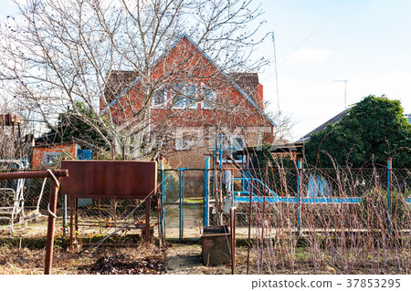 view of country house from backyard in winter 37853295