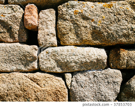 stone wall from pink granite boulders in Brehat 37853703