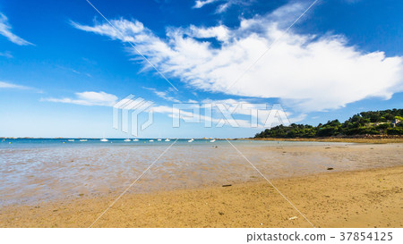 beach Plage de la Baie de Launay under blue sky 37854125