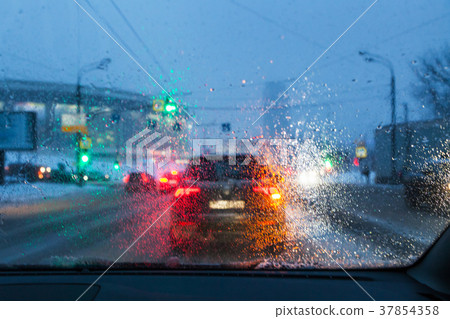 blurred background with drops on the windshield 37854358