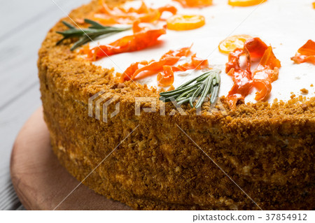 homemade carrot cake on gray wood background homemade carrot cake on gray wood background 37854912