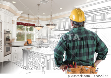 Male Contractor with Hard Hat and Tool Belt Looking At Custom Ki Male Contractor with Hard Hat and Tool Belt Looking At Custom Ki 37855136