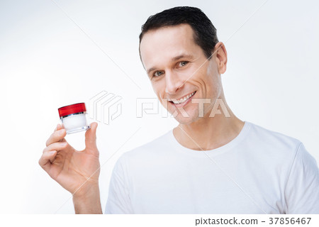 Delighted nice man using cream 37856467