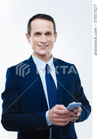 Smart intelligent businessman holding his 37857027