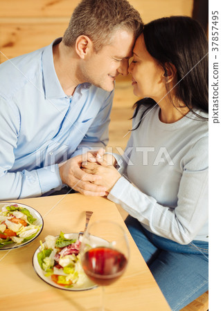 Loving man and woman holding hands Loving man and woman holding hands 37857495