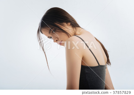 Wistful attractive woman thinking about future Wistful attractive woman thinking about future 37857829