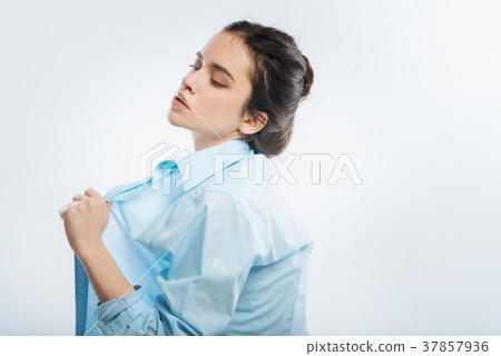 Kind vulnerable woman dressing up Kind vulnerable woman dressing up 37857936