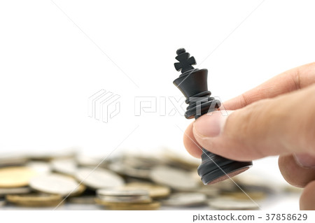 Businessman holding a King Chess is placed Businessman holding a King Chess is placed 37858629