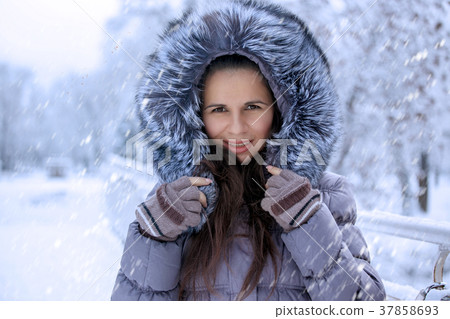 Portrait of a beautiful winter woman in fur hat  37858693