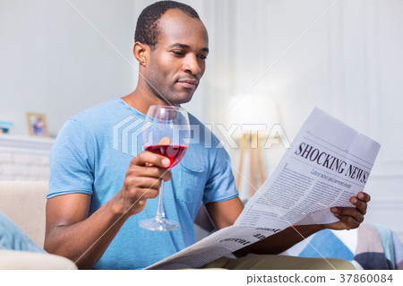 Pleasant nice man drinking alcohol Pleasant nice man drinking alcohol 37860084
