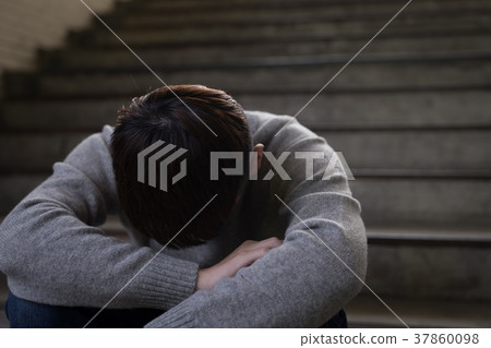 depressed man sit in underground 37860098