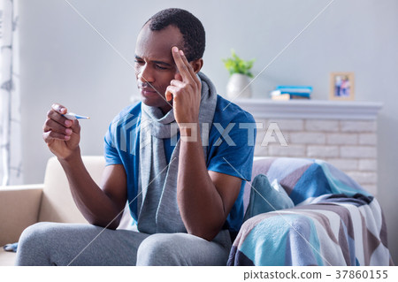Sad depressed man having a headache 37860155