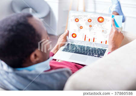 Handsome nice man looking at the statistics Handsome nice man looking at the statistics 37860586
