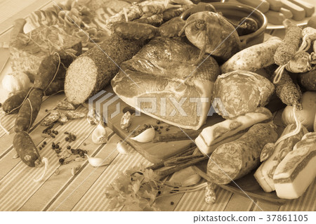 Variety of meats and sausages on table Variety of meats and sausages on table 37861105