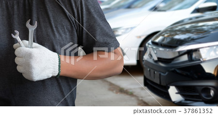 Mechanic repairing a car in garage Auto repair Mechanic repairing a car in garage Auto repair 37861352