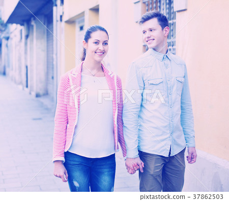 Girl and handsome man having a walk together 37862503