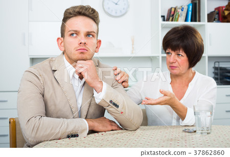 Mother calms the son 37862860