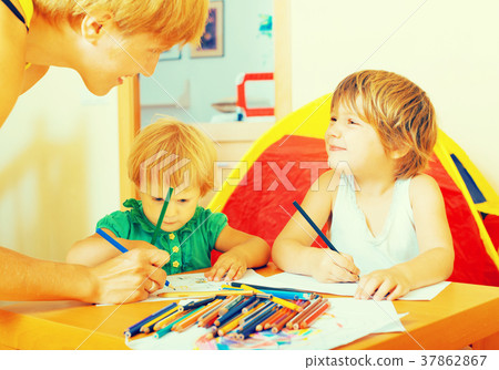 Mother and kids drawing with pencils Mother and kids drawing with pencils 37862867