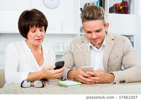 Mother and son with smartphones Mother and son with smartphones 37862887