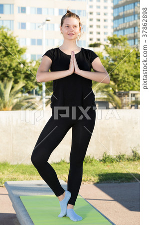 Young female during outdoor training yoga Young female during outdoor training yoga 37862898
