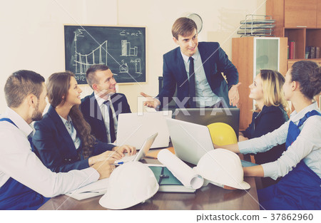 Architects discussing project at office 37862960