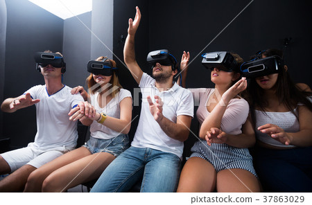 People wearing virtual reality goggles People wearing virtual reality goggles 37863029