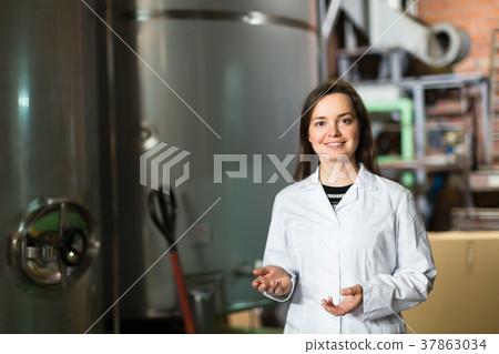 Woman at olive oil factory. 37863034