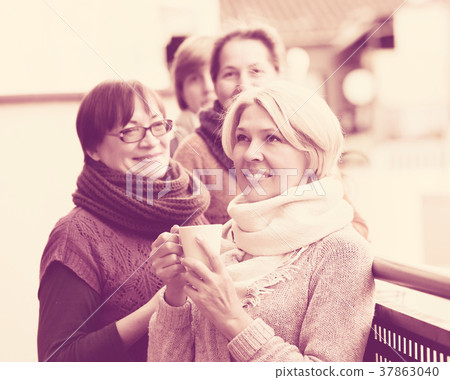 Women having tea on terrace 37863040