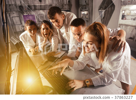 Friends are solving quests to get out of escape room 37863227