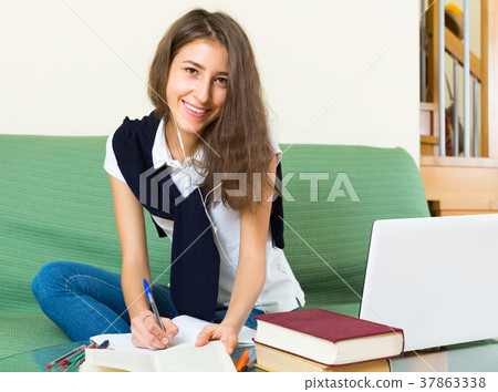 Teenager girl doing homework 37863338