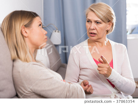 mother scolds her adult daughter mother scolds her adult daughter 37863354