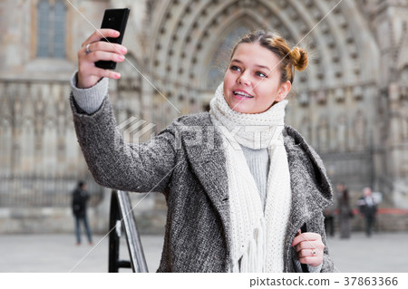 Young female making selfie Young female making selfie 37863366
