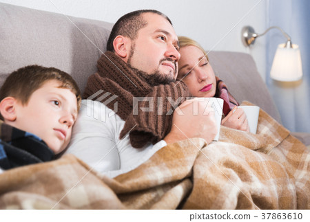 Family with son catching cold Family with son catching cold 37863610
