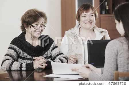 Three women with papers 37863728