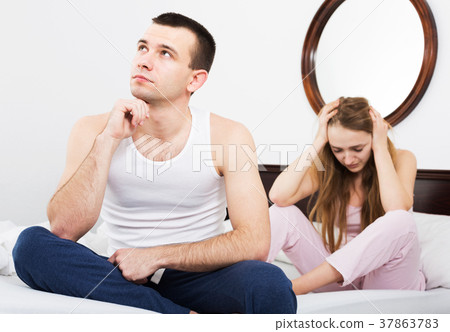 Sad couple in bed Sad couple in bed 37863783