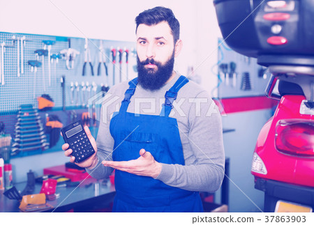 Repairman calculates the cost of a motorcycle repair Repairman calculates the cost of a motorcycle repair 37863903