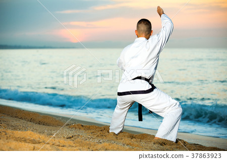 Male is training the Shiko-dachi stance Male is training the Shiko-dachi stance 37863923