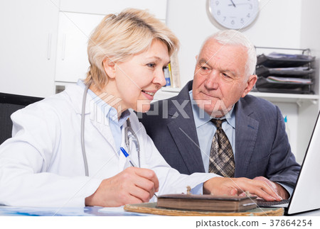 Female doctor with male client 37864254